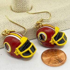 Former Washington Redskins football helmet earrings.